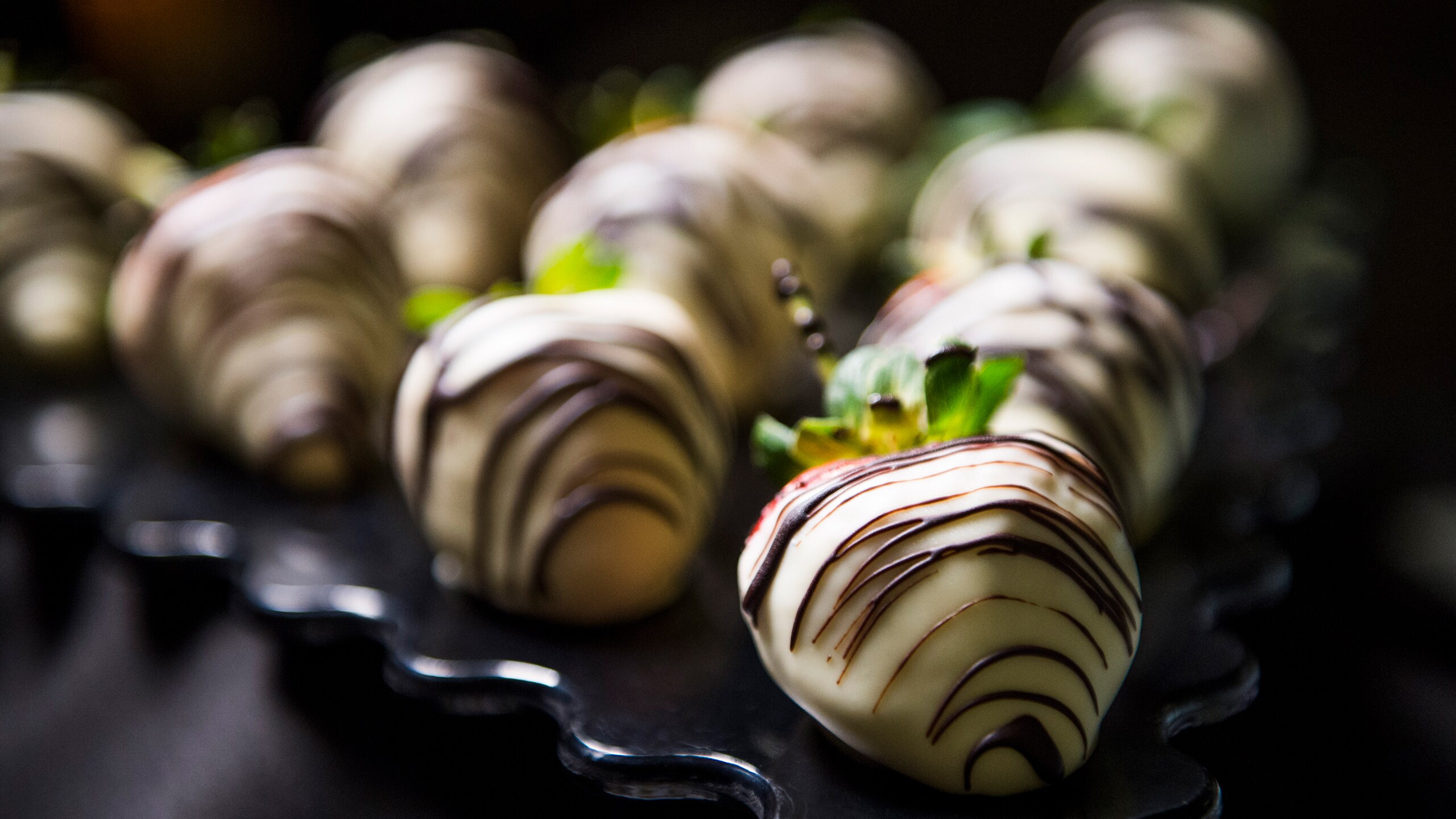 A plate of chocolate dipped strawberries