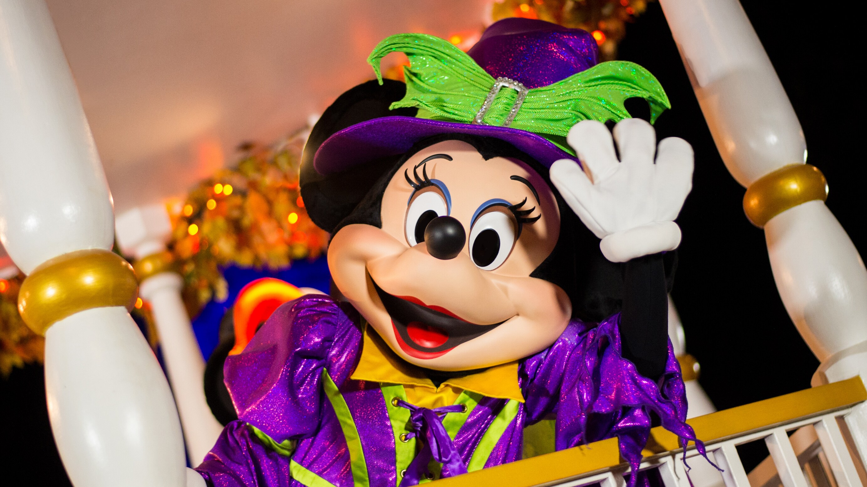Minnie Mouse waving while dressed in her witch Halloween costume Minnie Mouse waving while dressed in her witch Halloween costume