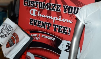 Custom Tee Center by Champion® A sign and book to customize your event t-shirt
