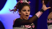 Cheerleading and Dance Worlds™ A spirited cheerleader performs with her mouth open