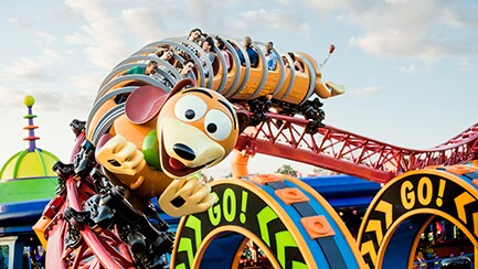 Guests scream while turning a corner at Slinky Dog Dash in Toy Story Land