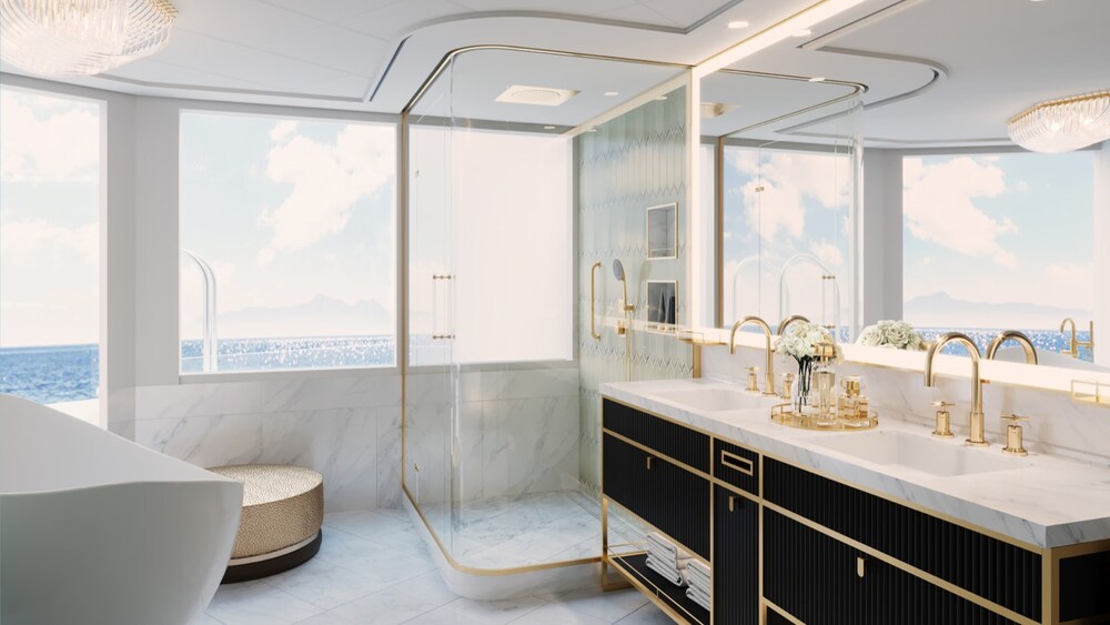 A Disney Wish Concierge One Story Royal Suite with Verandah bathroom with a mirror, bathtub, walk in shower, towels, 2 sinks and a large window facing the ocean