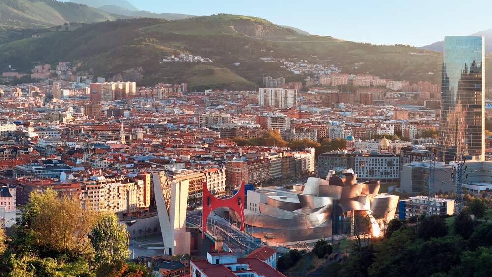 A cityscape next to mountains