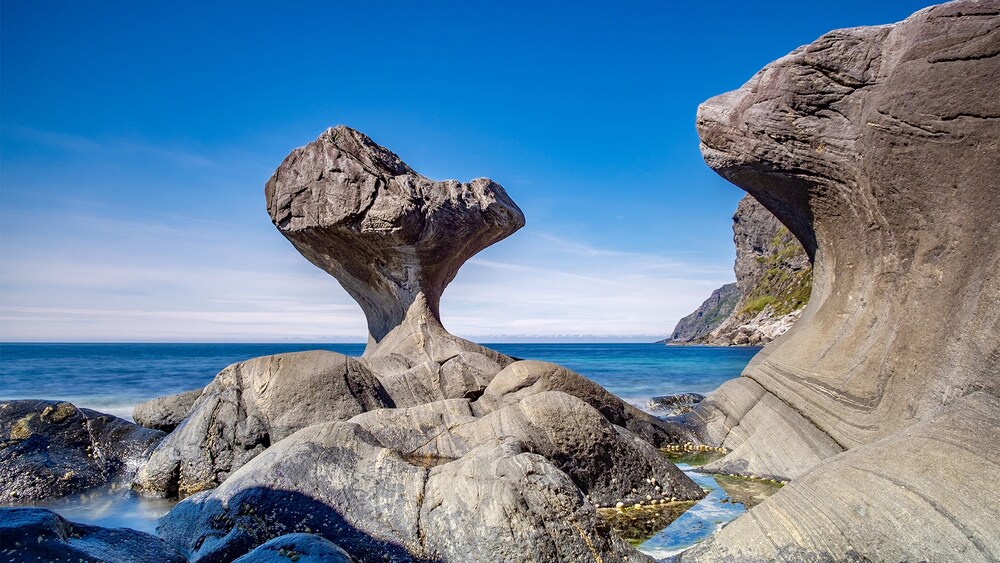 The famous mushroom shaped Kannesteinen Rock in Maloy, Norway