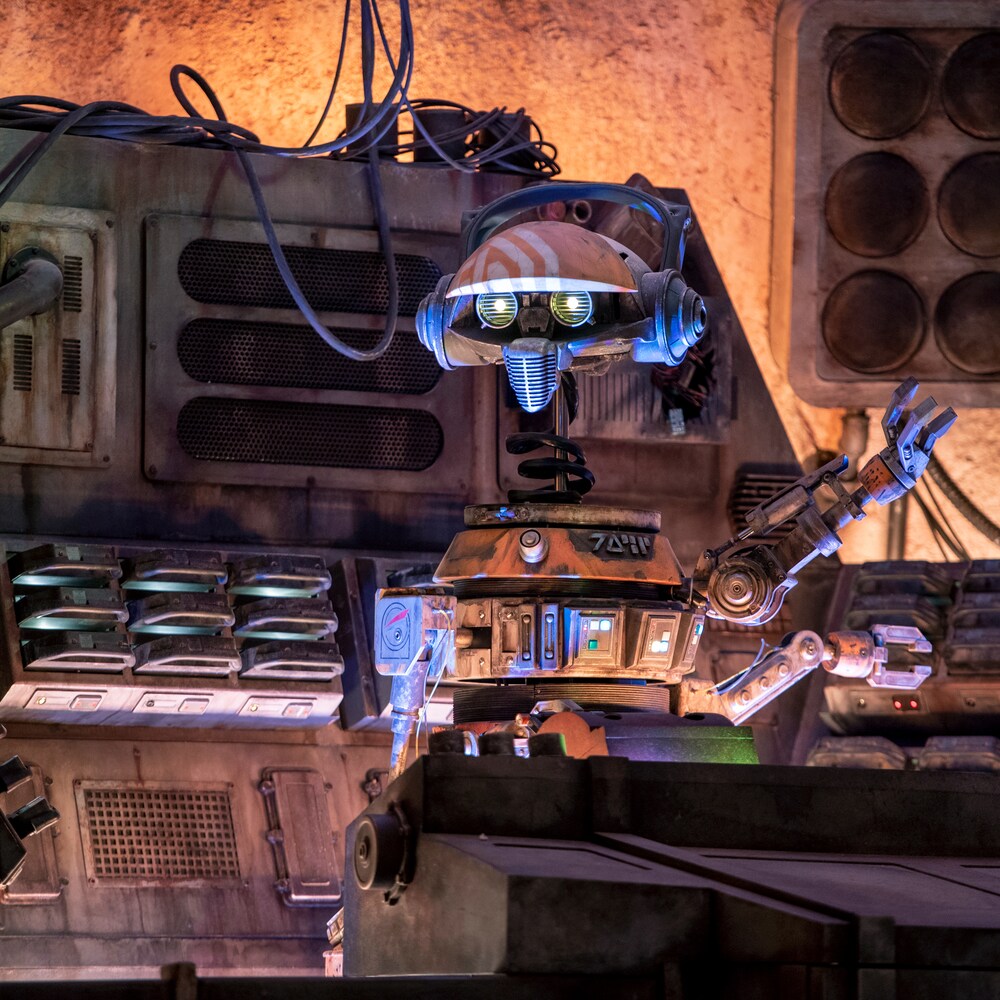 Droid DJ R 3 X, a former Starspeeder 3000 pilot, bounces up and down