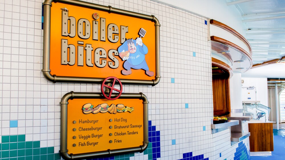 A sign says Boiler Bites and lists quick service American fare menu items
