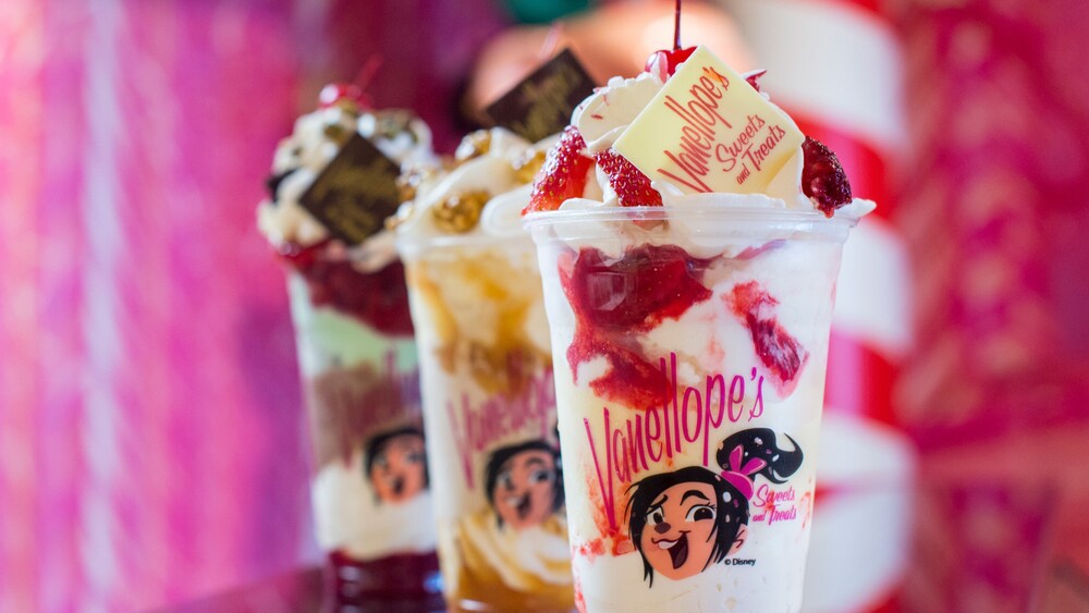 Dessert cups featuring Van ello pees Sweets and Treats logos