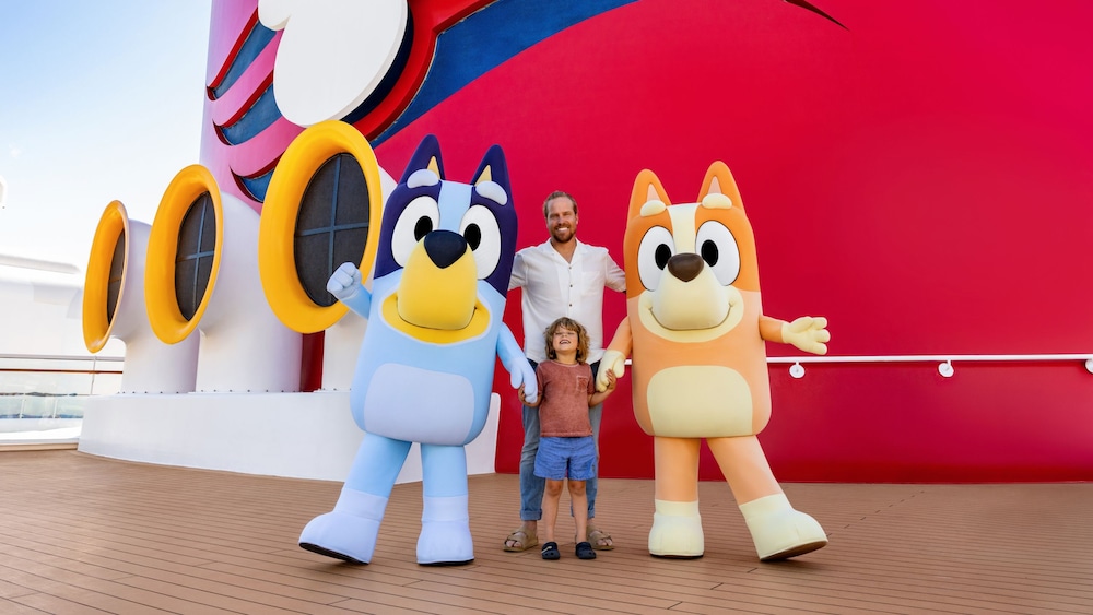 Bluey and Bingo posing together on a Disney Cruise ship