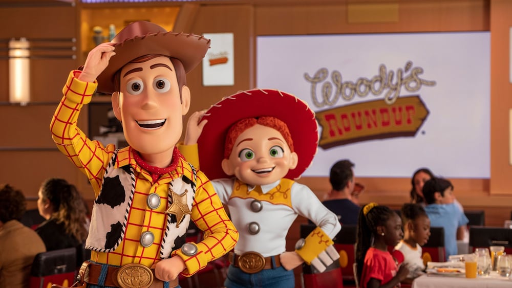 Woody and Jessie from ′Toy Story′ near Guests at Roundup Rodeo BBQ