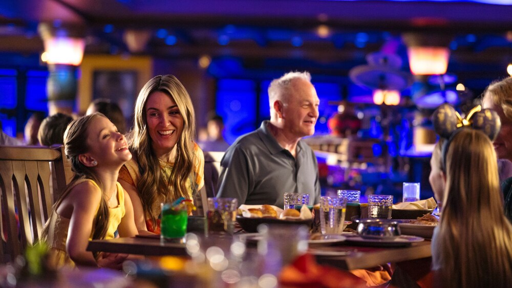 A multigenerational family sitting at a dining table together