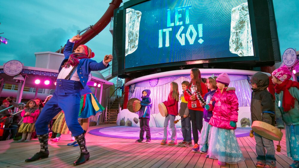 Children on stage with Cast Members at the Frozen Deck Party