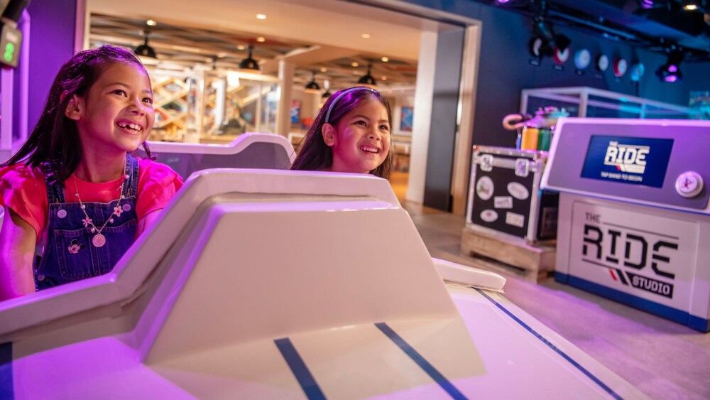 Two young girls at The Ride Studio in the Walt Disney Imagineering Lab