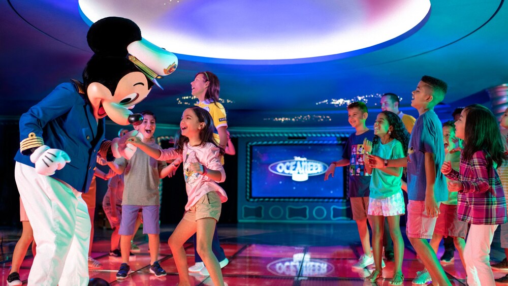 Kids dancing with Captain Mickey Mouse at Disney’s Oceaneer Club