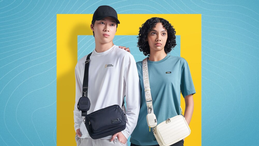 Two people wearing National Geographic apparel and accessories