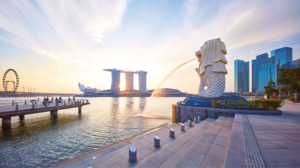 The Merlion fountain pouring into Marina Bay in Singapore