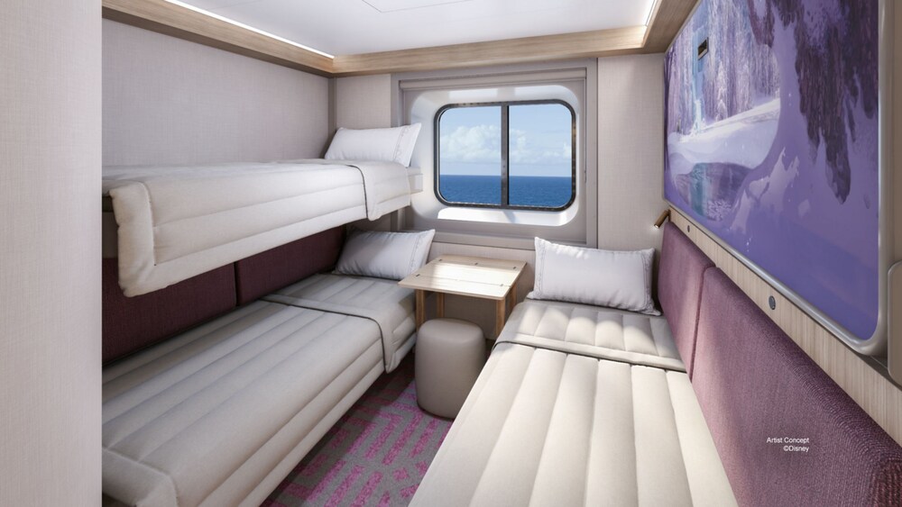 An Oceanview Stateroom with 2 sleeper sofas, a pull down bed and a window