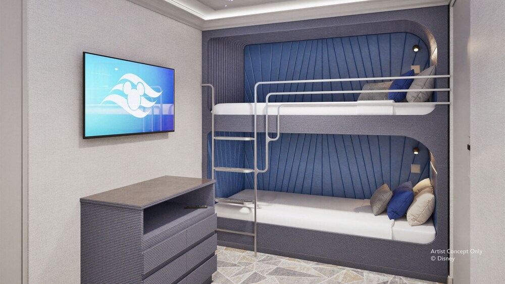 A kid’s room inside of The Tower Suite on the Disney Believe cruise ship, featuring 2 bunk beds