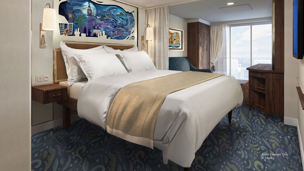 A Concierge stateroom on the Disney Believe cruise ship, featuring a bed, sofa and veranda