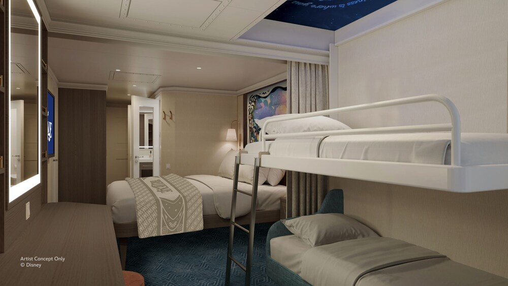 An Oceanview stateroom on the Disney Believe cruise ship, featuring a bed next to 2 bunk beds with decorative stars on the ceiling