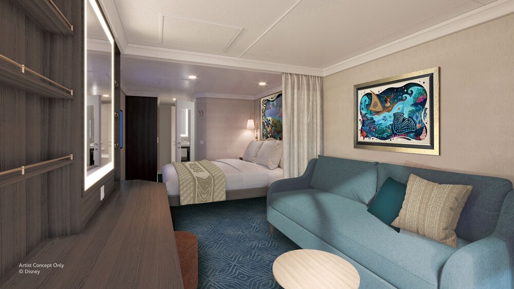 A Veranda stateroom on the Disney Believe cruise ship, featuring a bed and living room with sofa