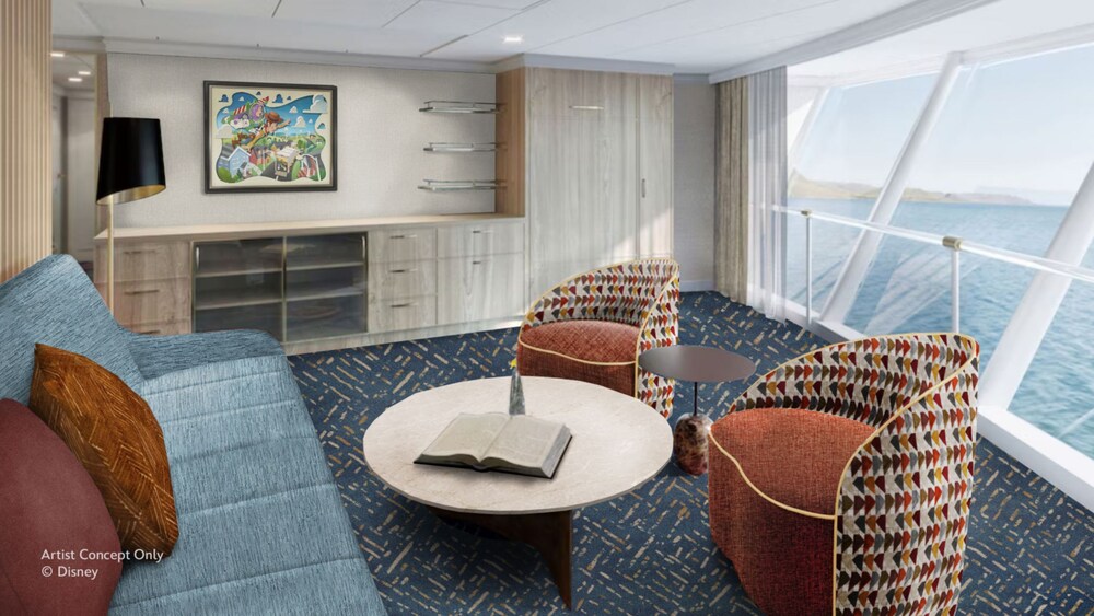A Concierge oceanview stateroom on the Disney Believe cruise ship, featuring a living room with sofa and chairs overlooking a large window