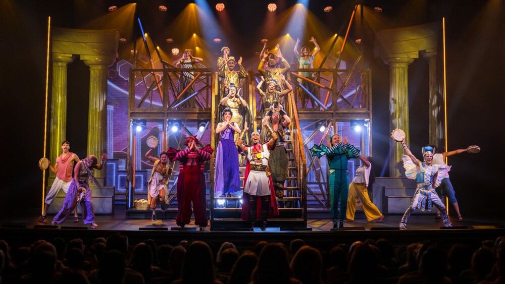 The cast of Disney Hercules performing on stage