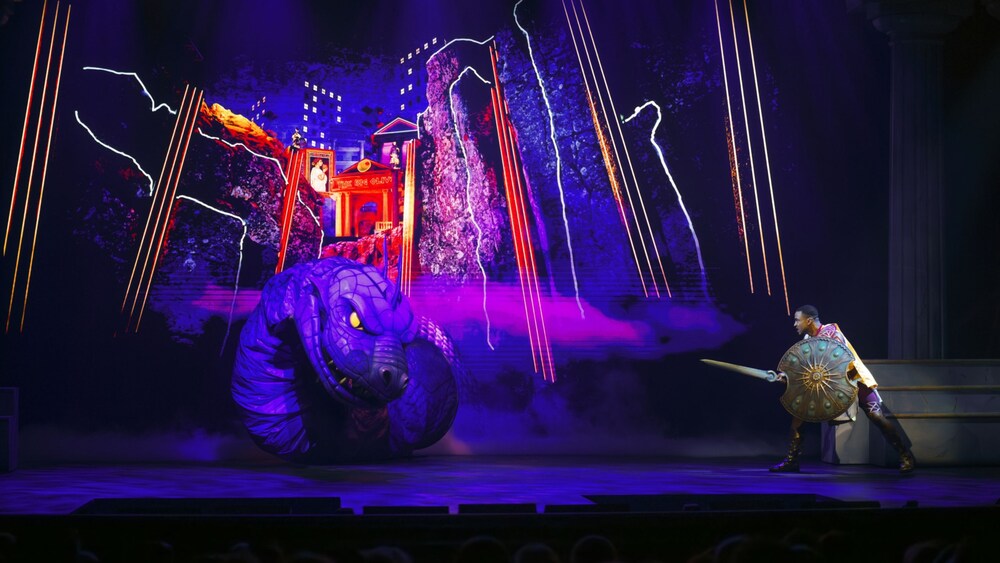 Hercules battling Hydra on stage in a performance of Disney Hercules