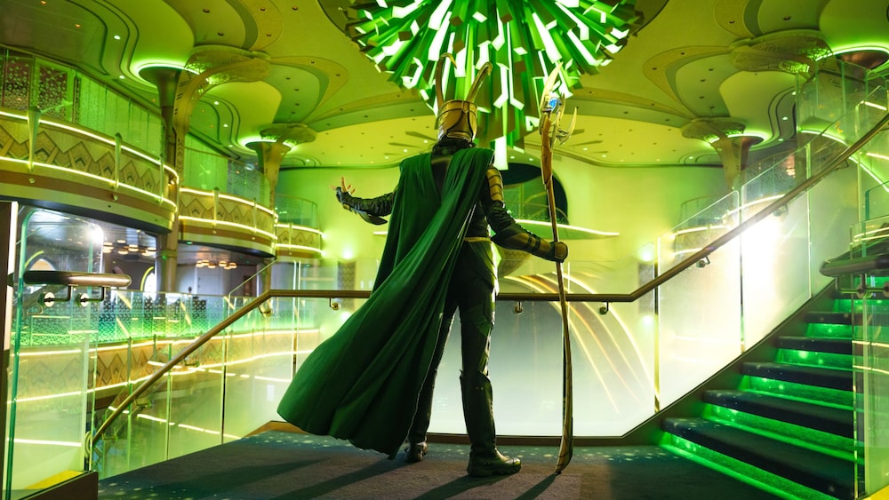 Loki striking a dramatic pose overlooking the Grand Hall of the Disney Destiny