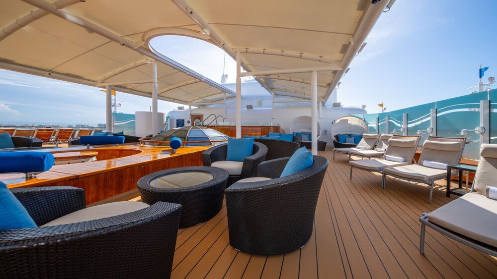 Sofas, table and chairs on the Disney Dream Concierge Sundeck