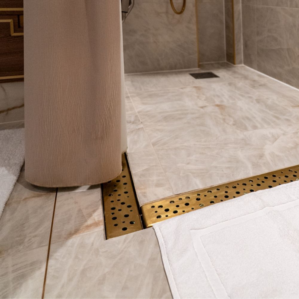 A wheelchair accessible entrance to a shower in a Disney Dream Concierge Dream Tower Suite