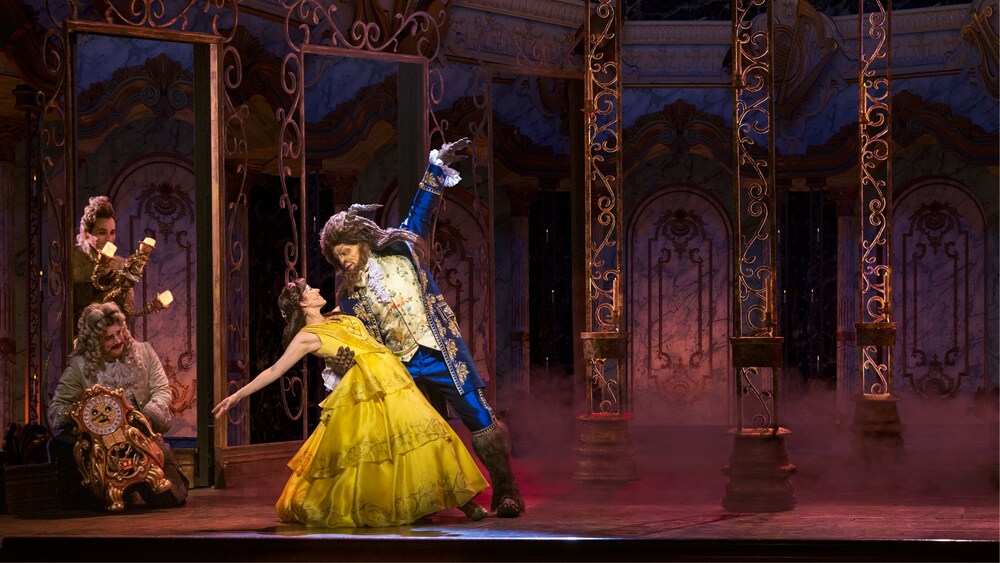 Belle and Beast dancing onstage during the Beauty and the Beast live show