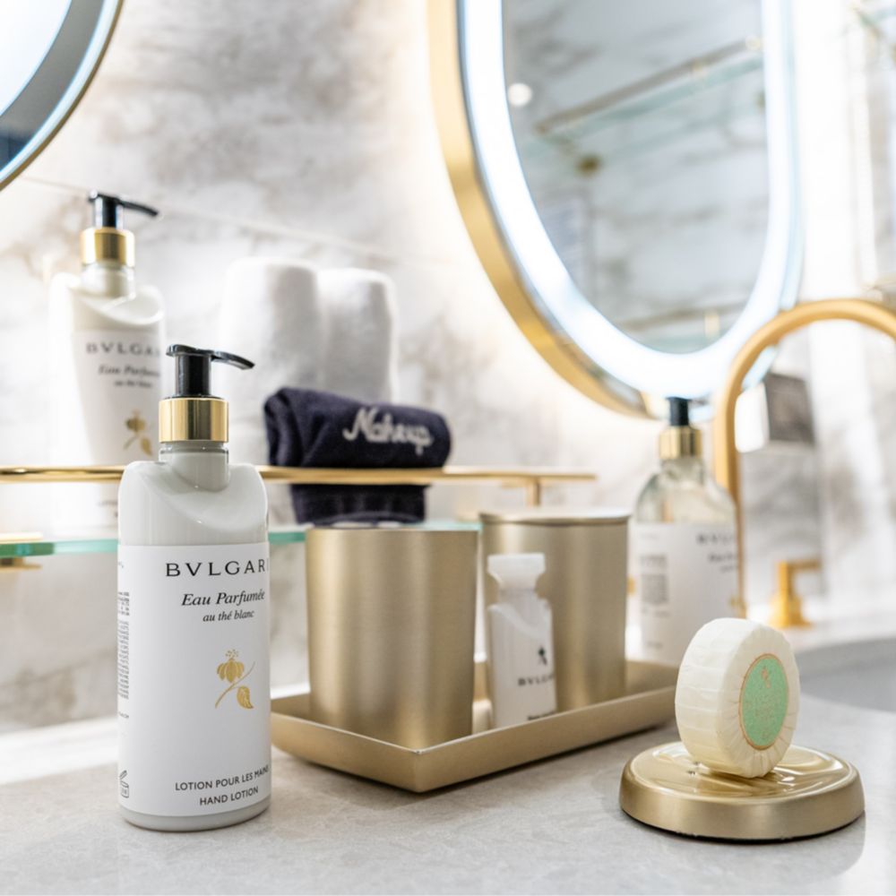 A bathroom with Bulgari hand lotion and soap in a Disney Magic Concierge 2 Bedroom Suite with Verandah