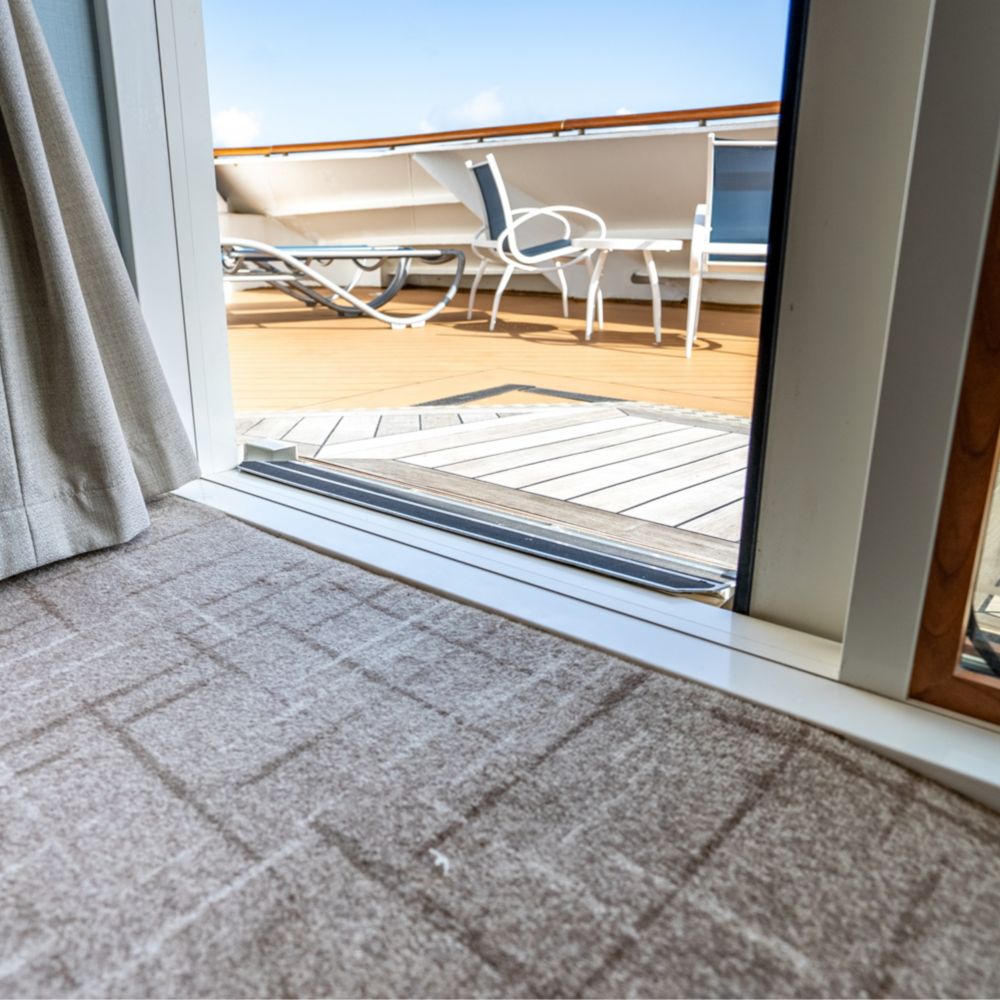 A wheelchair accessible entrance to the verandah in a Disney Magic Concierge 1 Bedroom Suite with Verandah