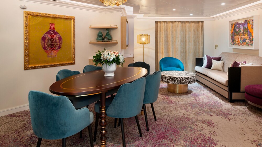 An artist rendering of a Disney Treasure 2 Story Royal Suite with Verandah Stateroom with a dining table, a verandah, a sofa and a low table