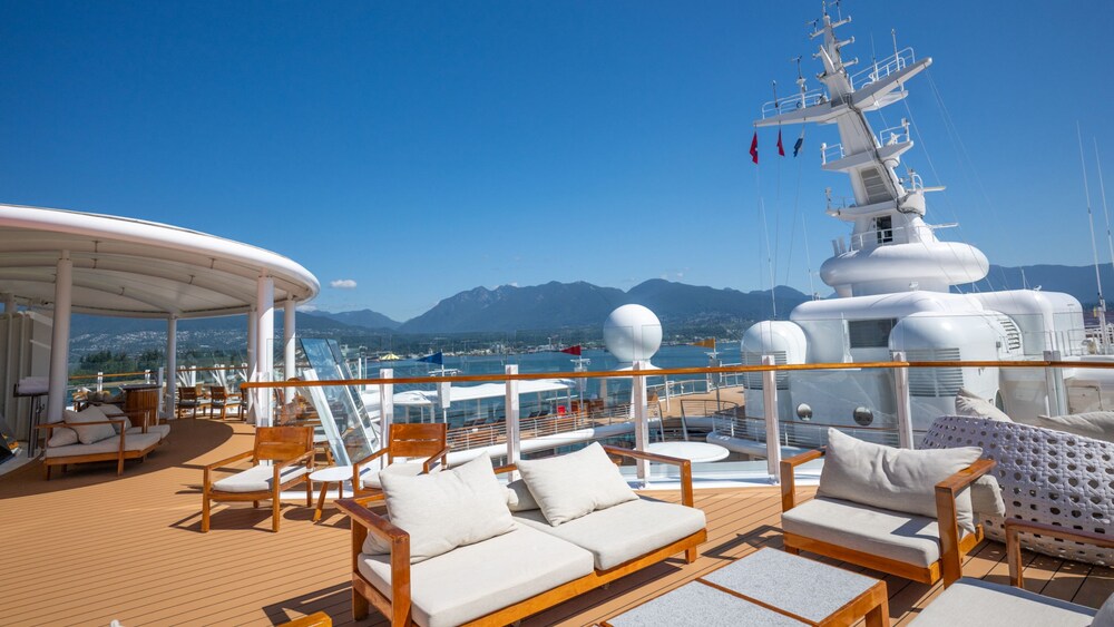 Sofas, table and chairs on the Disney Wonder Concierge Sundeck