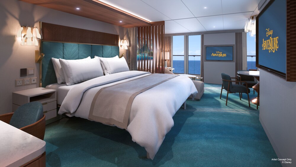 An artist rendering of a Disney Adventure Concierge Family Oceanview with Verandah Stateroom with a bed, dining table, chairs, sofa, coffee table, TV and a verandah facing the ocean