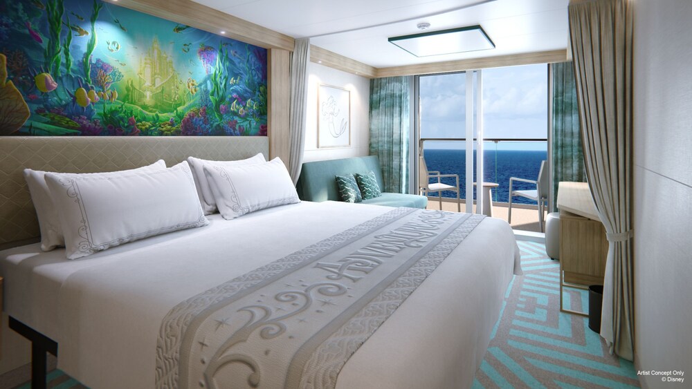 An artist rendering of a Deluxe Oceanview Stateroom with Verandah on the Disney Adventure with a bed, sofa, artwork inspired by The Little Mermaid and a verandah with an ocean view