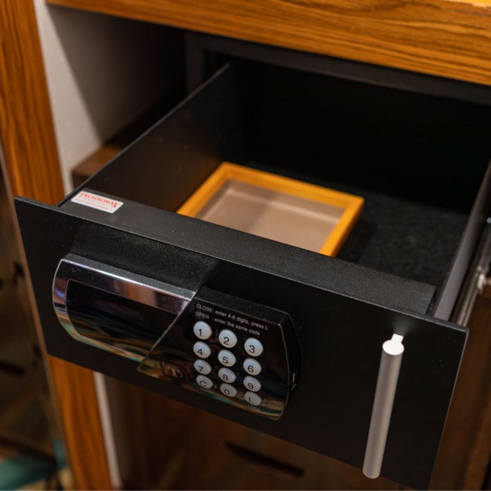 A safe with a drawer and a numeric keypad
