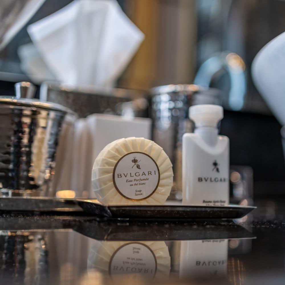 Bulgari bar soap and lotion in a tray on a bathroom counter