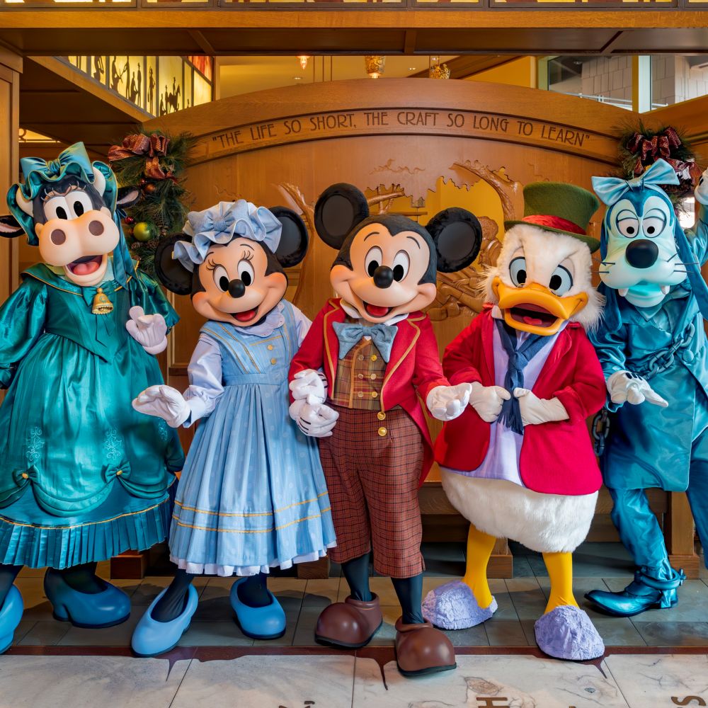 Clarabelle, Mickey Mouse, Minnie Mouse, Goofy and Donald Duck in old time Christmas clothing