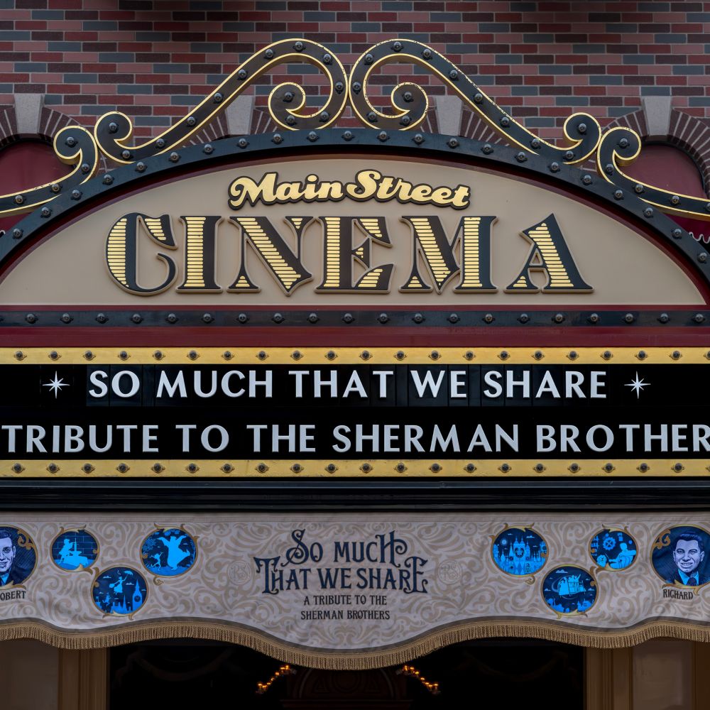 The marquee of the Main Street Cinema attraction featuring text that reads 'So Much That We Share a Tribute to the Sherman Brothers'