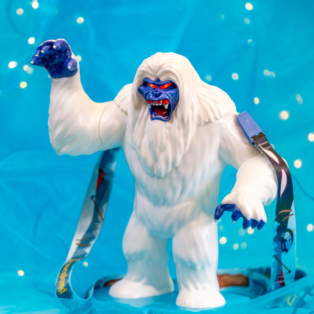 A sipper on a lanyard featuring the Abominable Snowman baring his fangs, with one clawed paw raised