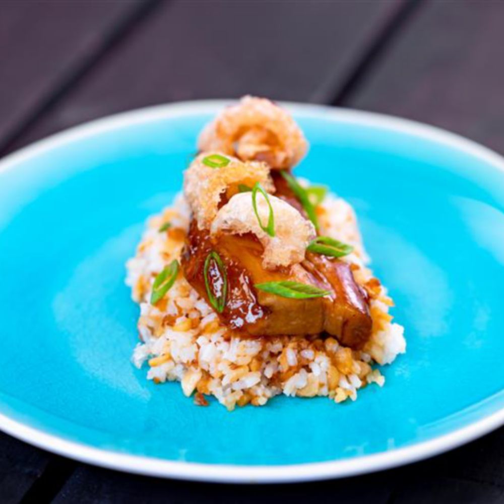 Braised Pork Belly Adobo and garlic fried rice on a plate