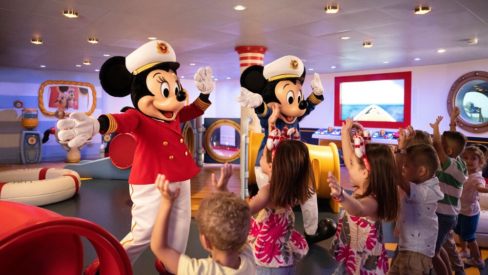 Captains Mickey and Minnie Mouse entertaining children on Mickey & Minnie Captain’s Deck