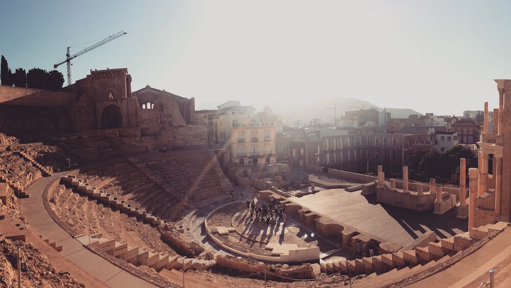 Tiered stone seating overlooks the restored stage at Cartagena's Roman Theatre