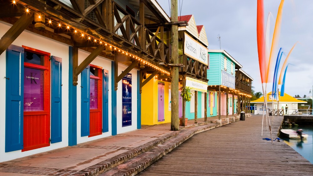 Shuttered shops along a historic waterfront boardwalk in Saint John's, Antigua and Barbuda  