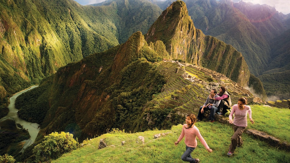 A family of 4 hiking in the mountains of Peru by Machu Picchu