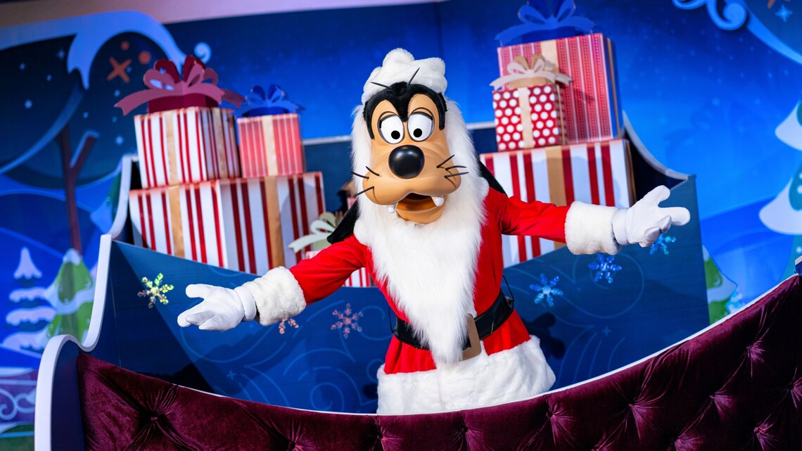 Goofy with a sled full of presents during Holidays at Walt Disney World Resort