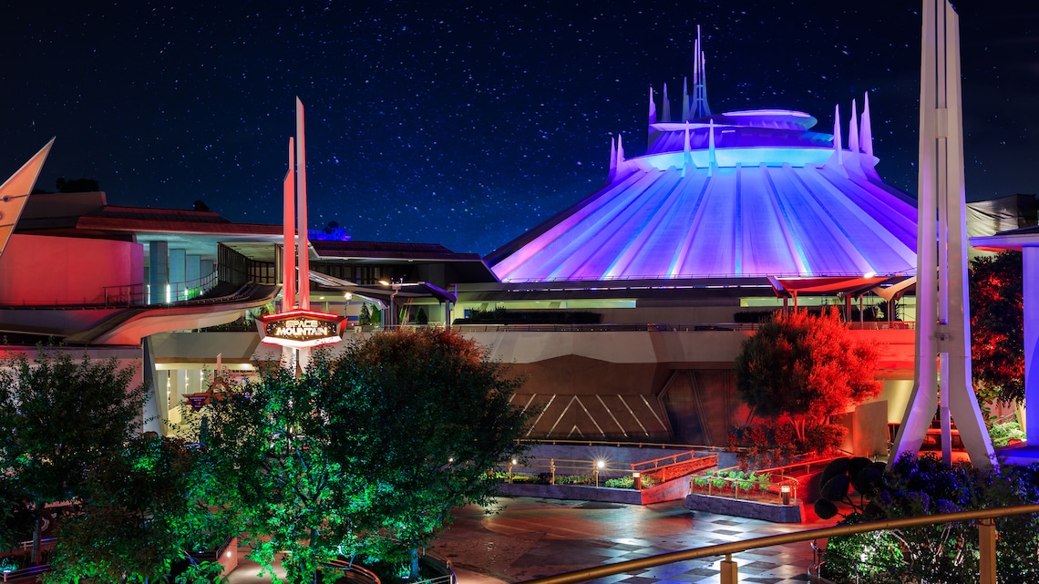 Nighttime view of the exterior of Space Mountain ride inside Tomorrowland at Disneyland Park