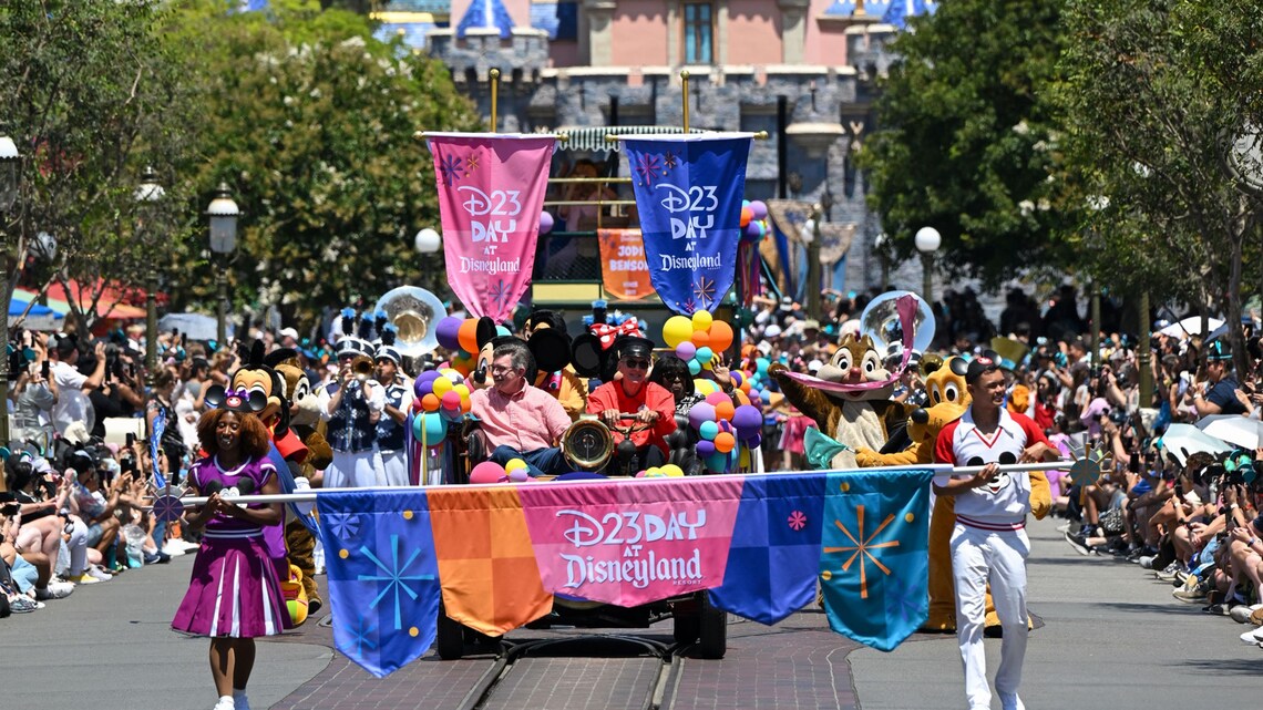 A D23 Day at Disneyland parade float with Mickey Mouse, Minnie Mouse, Chip, Dale and Pluto on Main Street USA in front of Sleeping Beauty Castle 